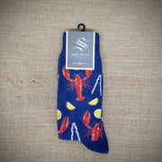 A navy pair of socks with lobsters on them.