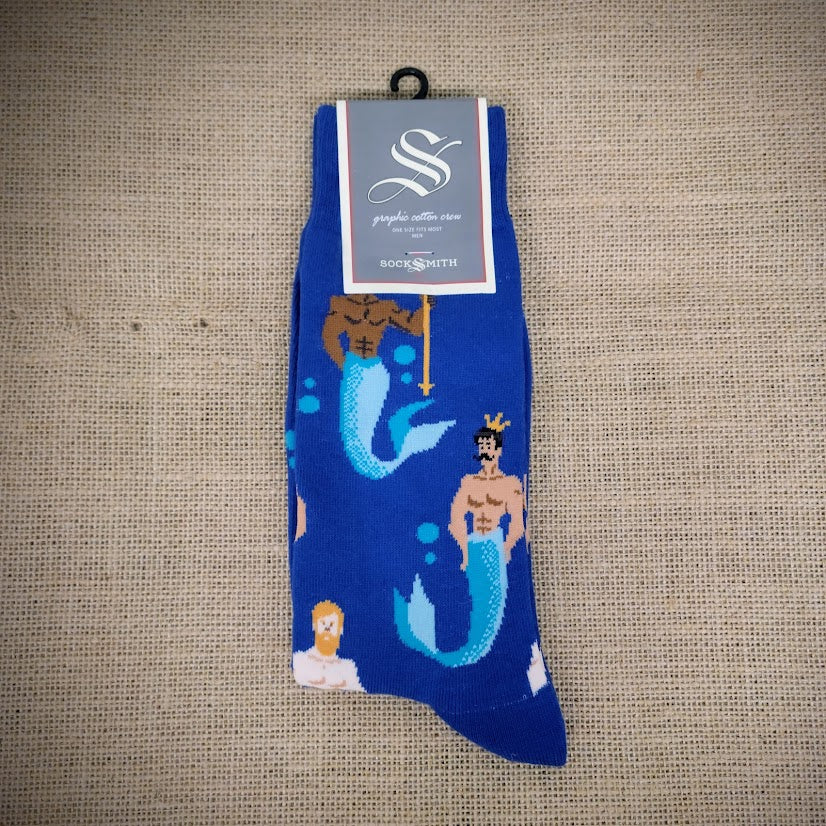 A blue pair of socks with mermen on them.