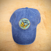 Classic, navy dad hat with a 'Cape May Monarch' patch ironed on the front.