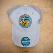 Khaki, trucker hat with a 'Monarch Cape May' patch ironed on the front.