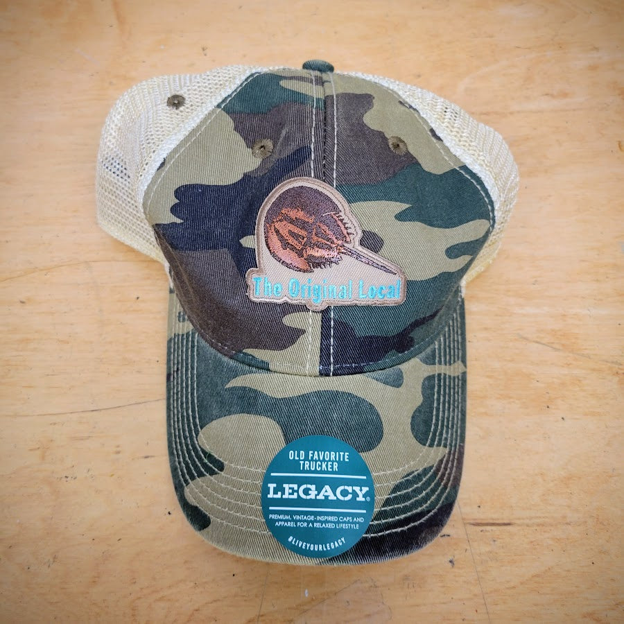 Camo-colored trucker hat with an 'Original Local, Horseshoe Crab' patch on the front.