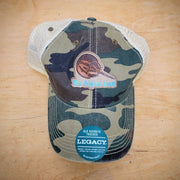 Camo-colored trucker hat with an 'Original Local, Horseshoe Crab' patch on the front.