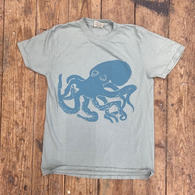 A greenish-blue t-shirt with an 'Octopus' design on the front in teal ink.