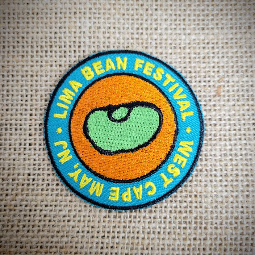 Round, blue patch that features the words, 'Lima Bean Festival' & West Cape May, NJ. Includes a bean in the center.
