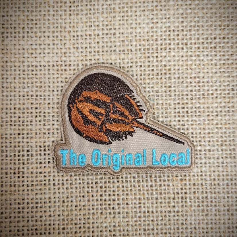 Horseshoe Crab Patch with text underneath that says 'Original Local.'