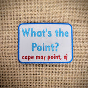 Rectangle, blue-rimmed, white patch that features "What's the Point?" on the front, along side Cape May Point, NJ.