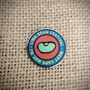 A Lima Bean Festival pin.