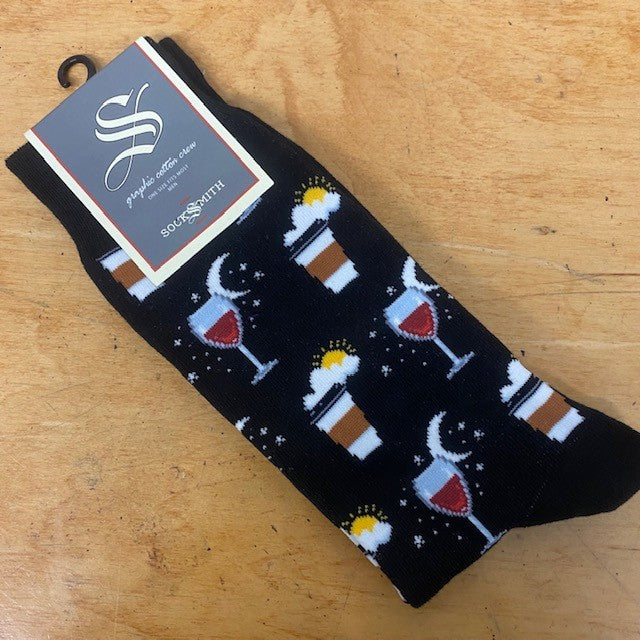 A pair of black socks with wine and coffee on them.