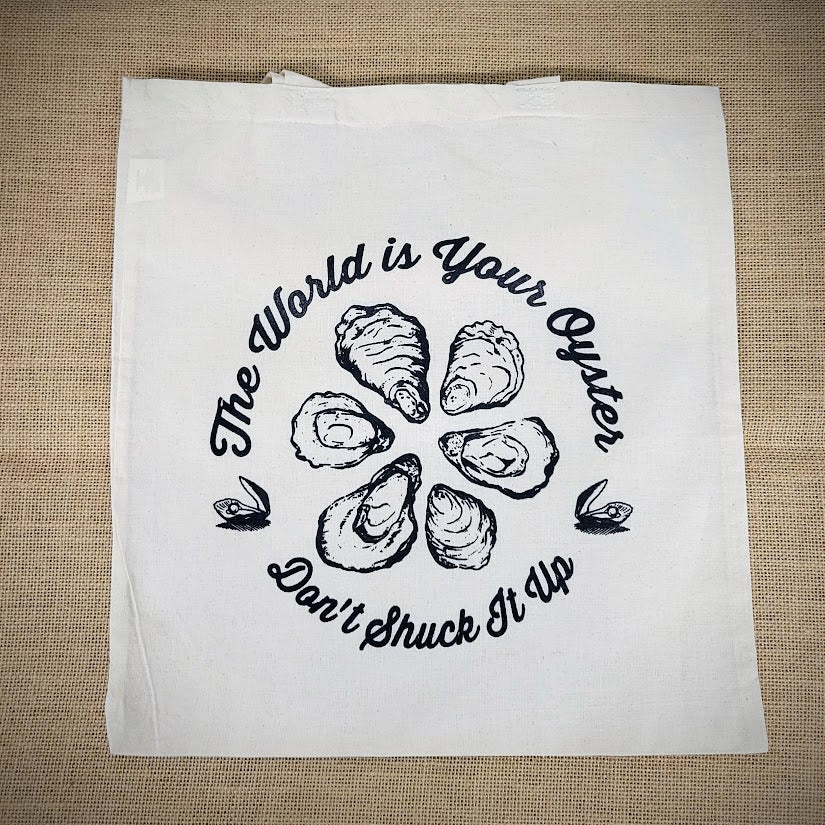 Natural. canvas tote bag with 'The World is Your Oyster, Don't Shuck it Up' design.