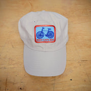 A khaki hat with a 'West Cape May' patch hat on it.