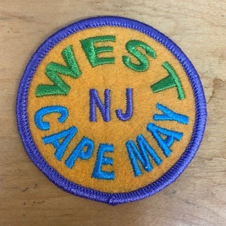 Multi-colored round patch that features West Cape May NJ in bold text.