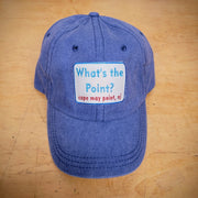 A blue, classic dad hat with a 'What's the Point?' patch on the front.