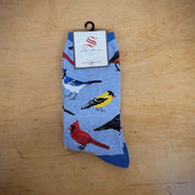 A pair of blue socks with birds on them.
