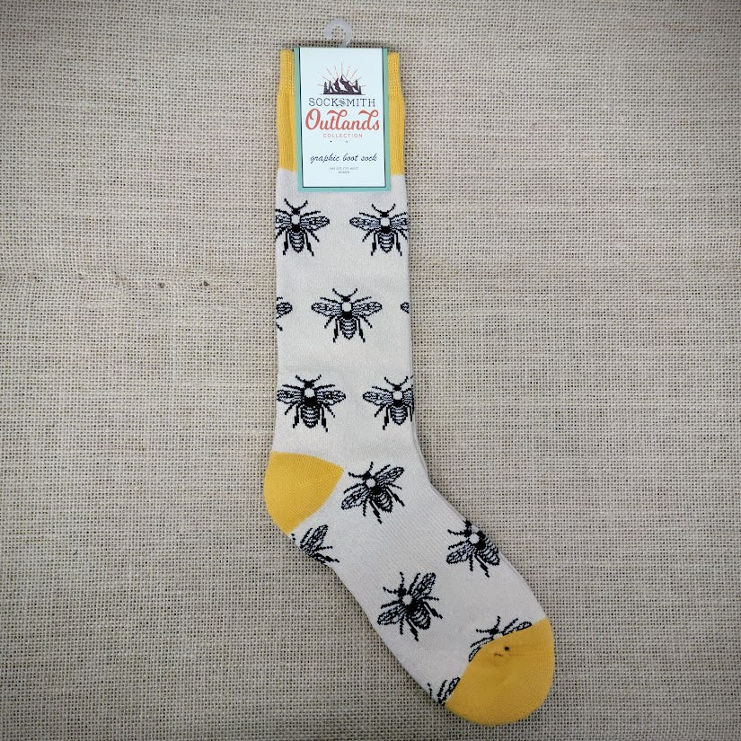 A pair of cream and yellow bee boot socks.