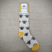 A pair of cream and yellow bee boot socks.