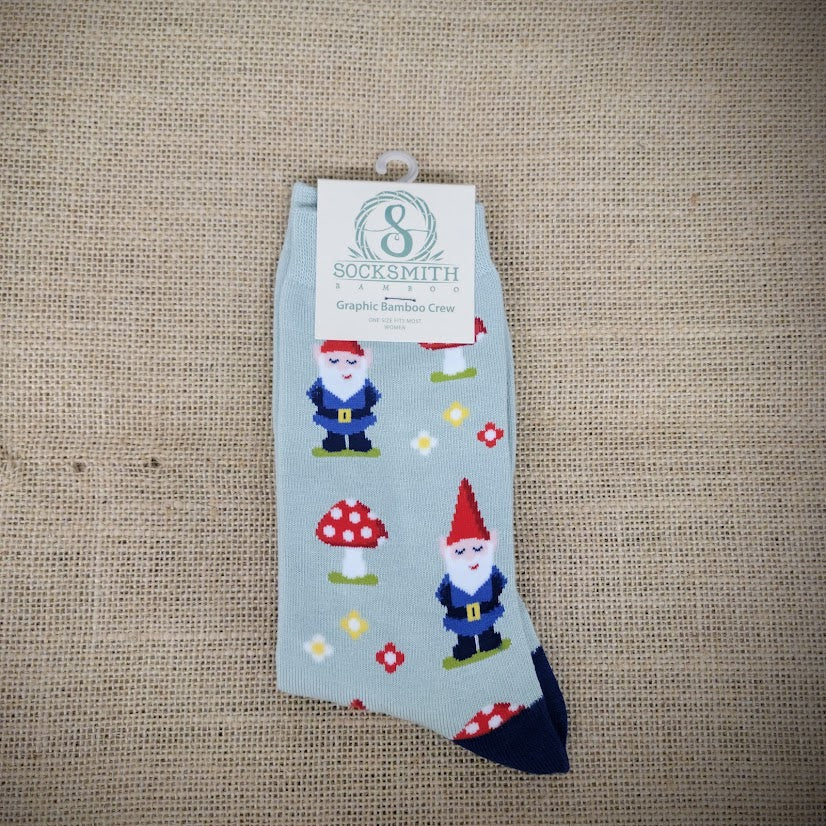 A pair of minty blue socks with gnomes on them.