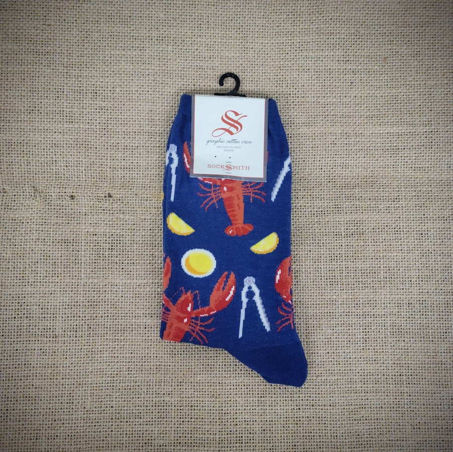 A navy blue pair of socks with lobsters on them.