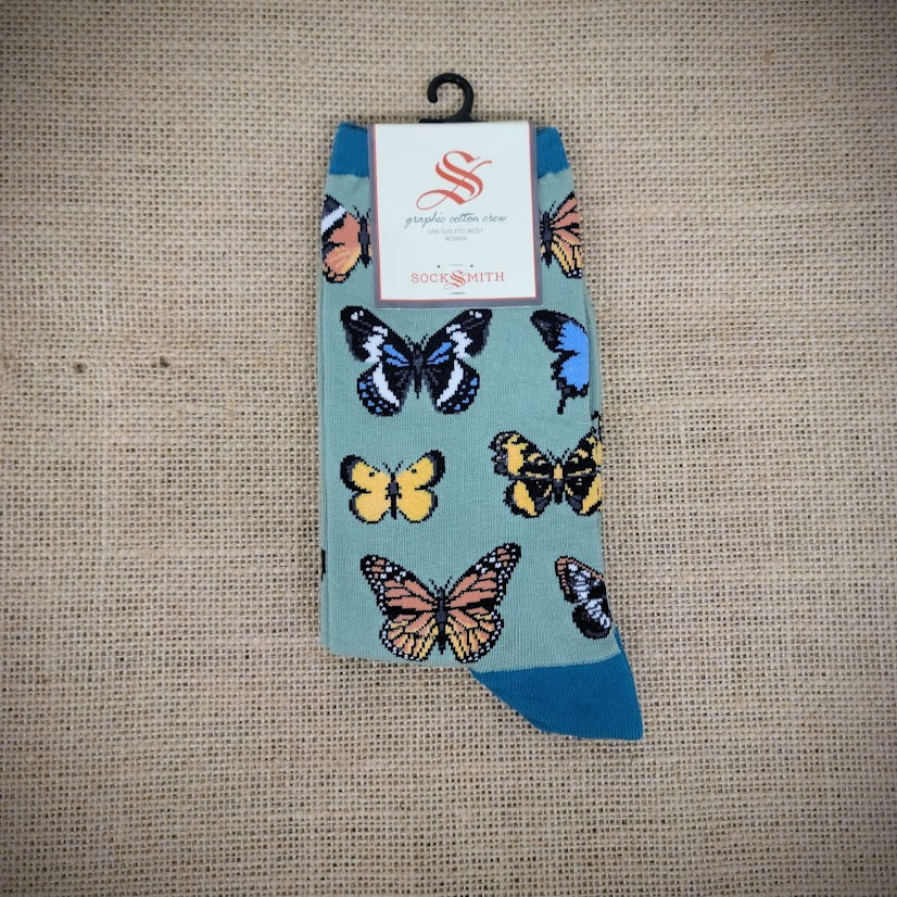 Green, women's socks with an assortment of butterflies on them.