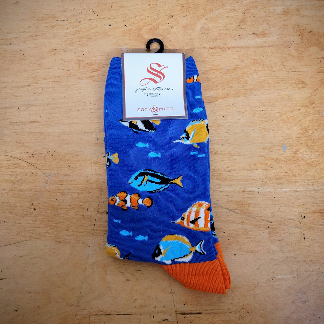 A pair of blue socks with fish on them.