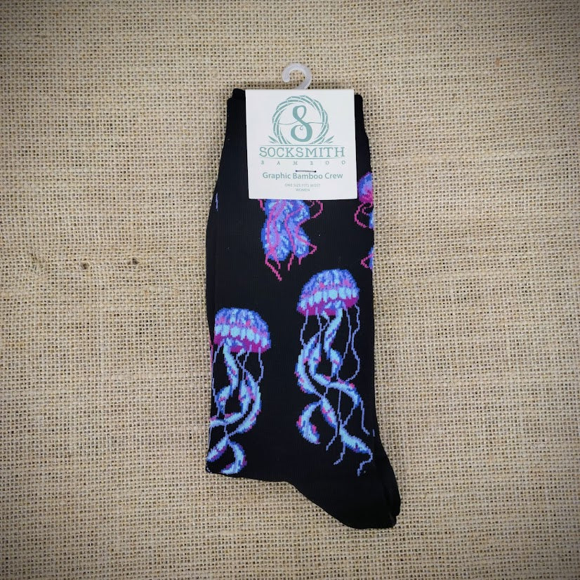 A black pair of socks with sea jellies on them.
