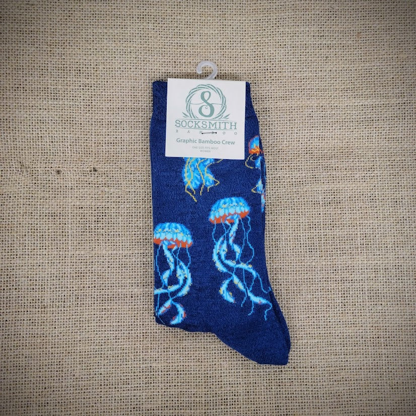 A pair of blue socks with sea jellies on them.