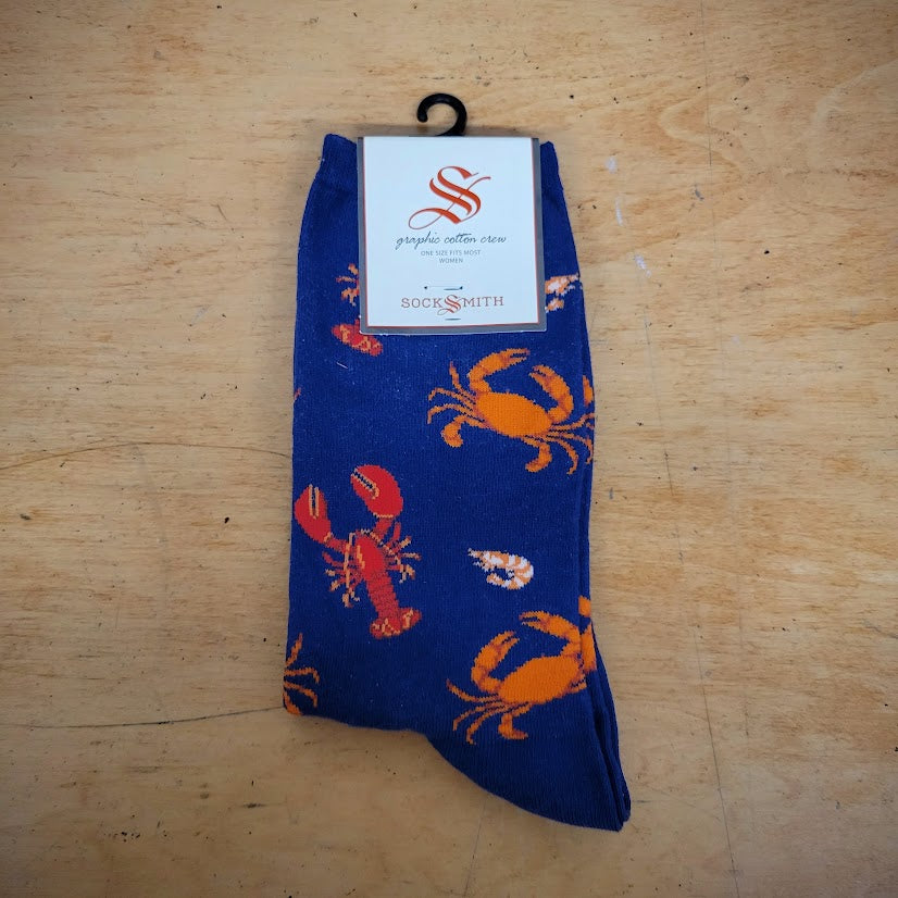 A pair of navy socks with sea life on them.