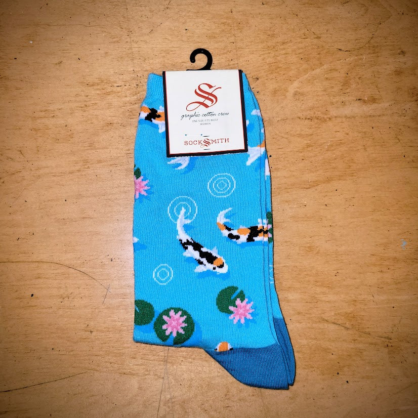 A pair of blue socks with koi fish on them.