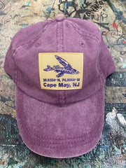 Classic, wine-purple dad hat with a 'Flying Fish Coordinates' patch ironed onto the front.