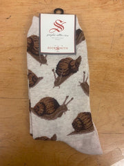 An ivory pair of socks with snails on them.